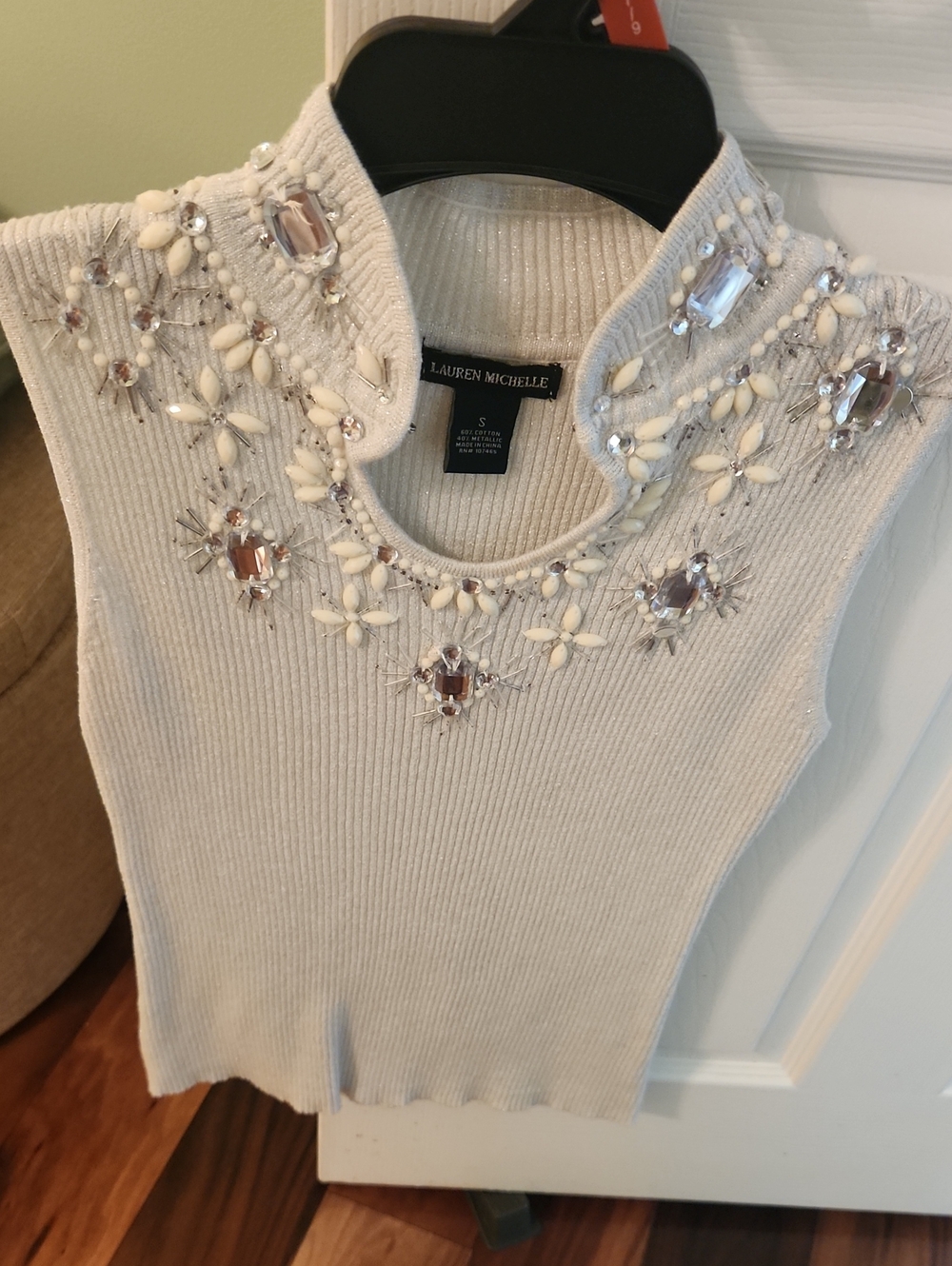 Lauren Michelle Ivory Beaded Sleeveless Knit Blouse with Beautiful designs.
